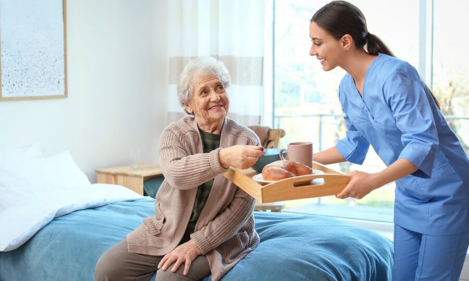 Caregiver bringing breakfast to an elderly client