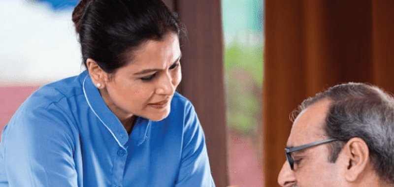 Caregiver giving one-on-one special needs care at home